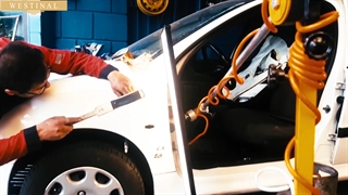 صافکاری PDR درب و گلگیر خودرو خودروی 206 در تعمیرگاه وستینال